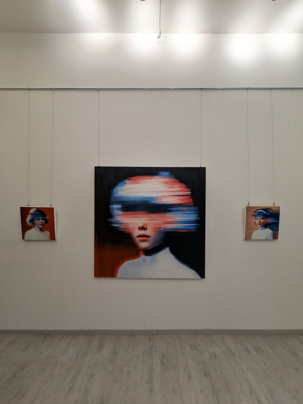 Nuclear Seed by JoCa installed in the exhibition with the other Seed paintings